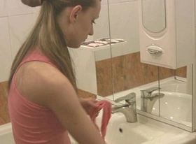 Girl pisses sitting in the toilet