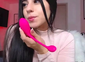 Busty clothed camgirl sucks vibrator